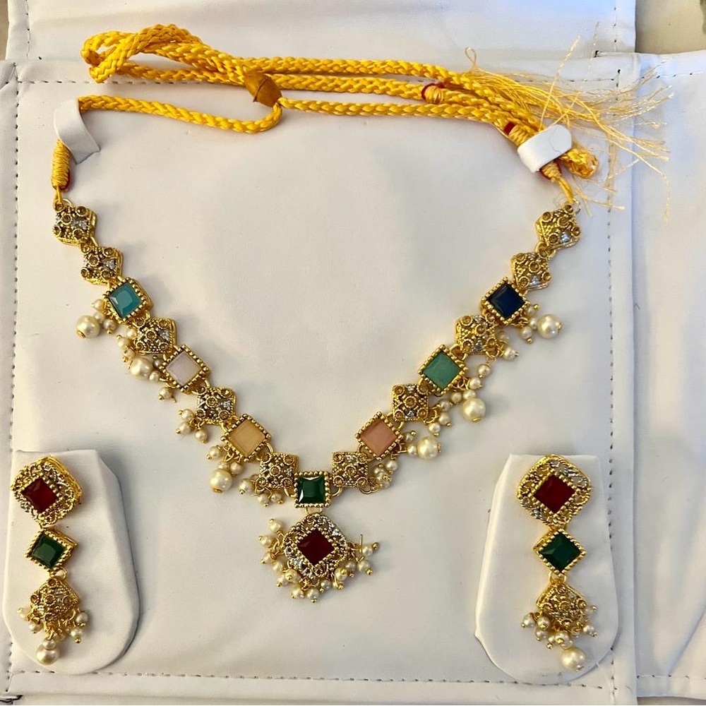 Golden jewelry set with multi color stones